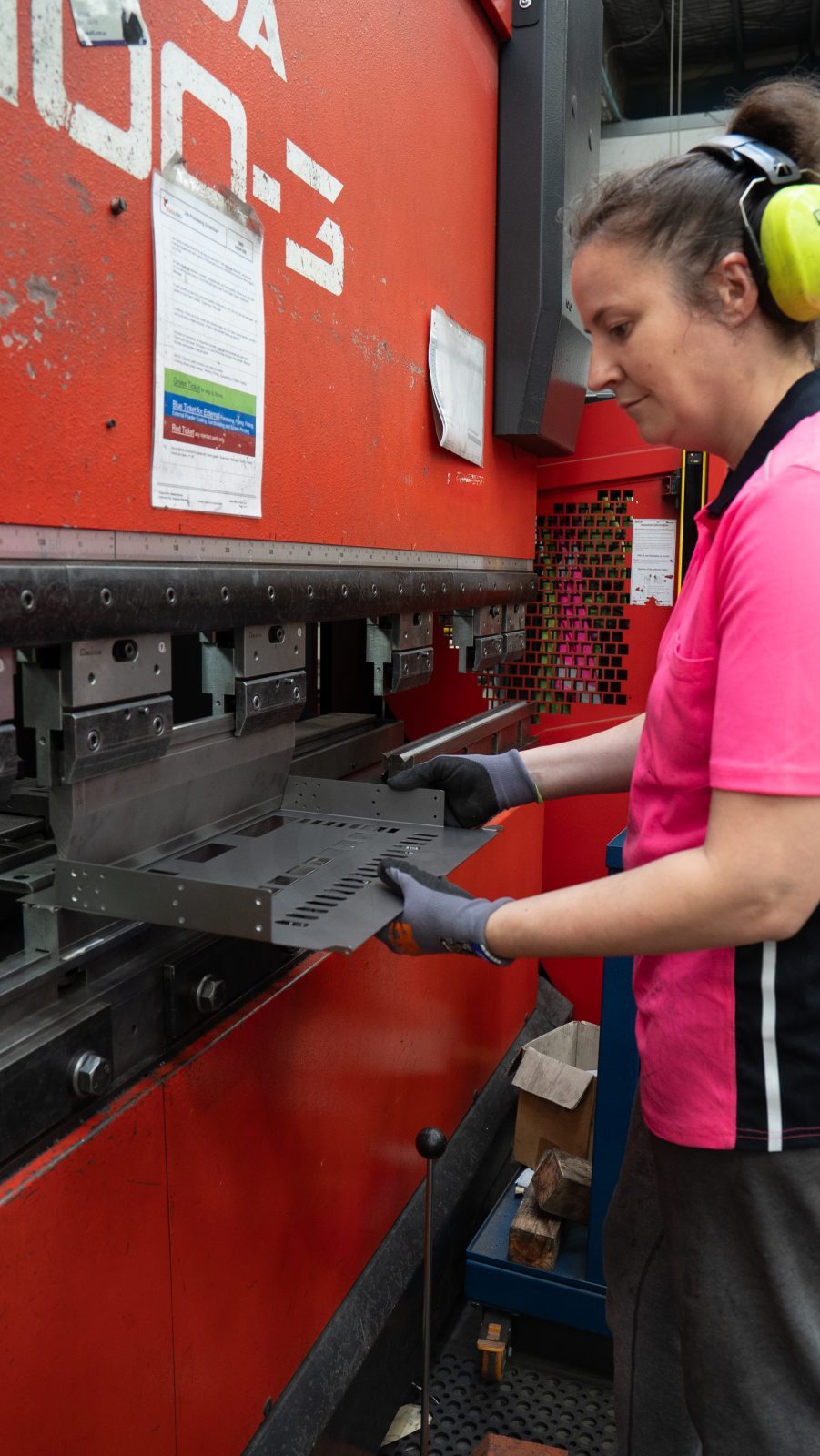 Operator folding a sheet metal part on the press brake
