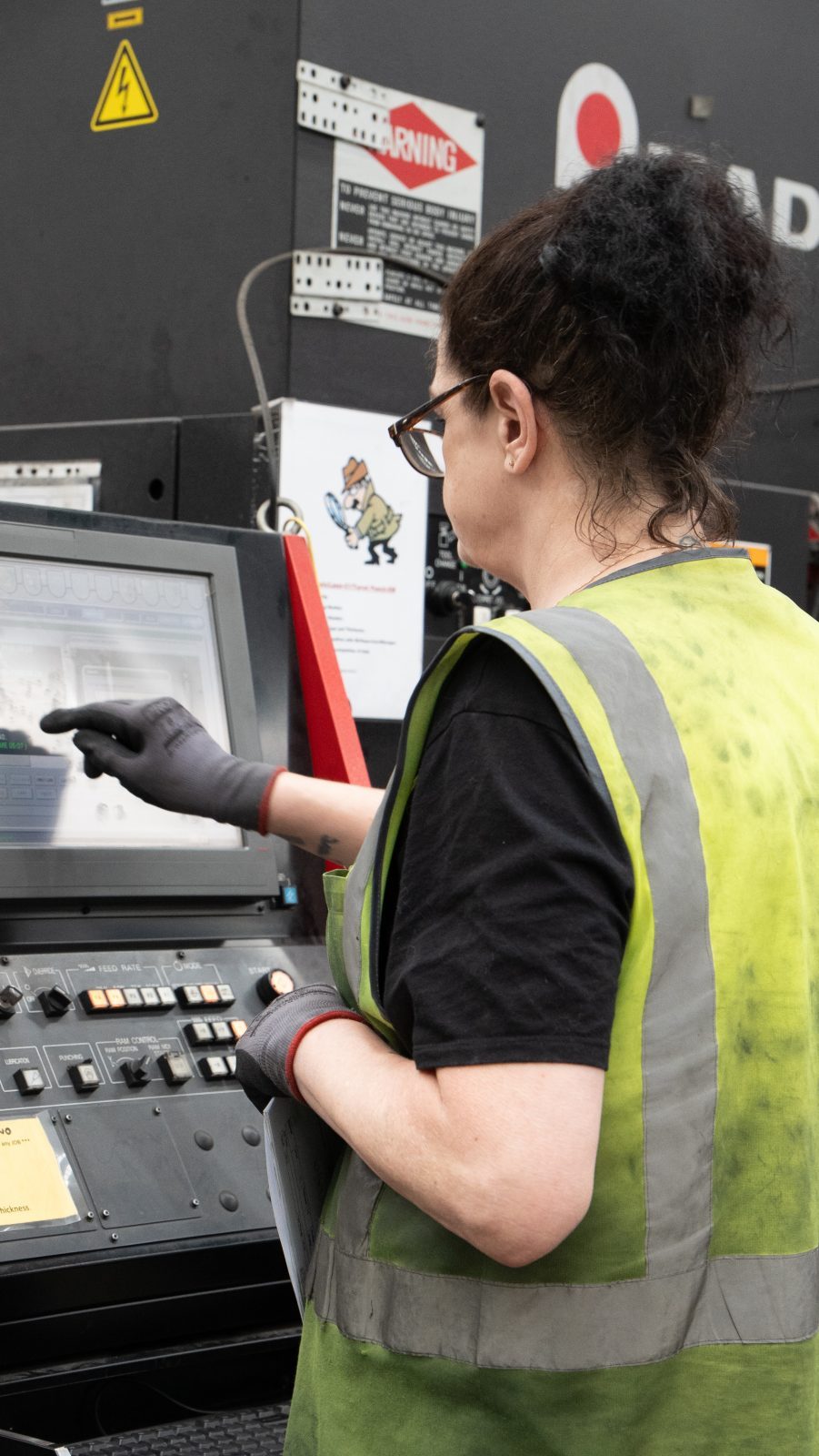 Operator at the turret punch control panel
