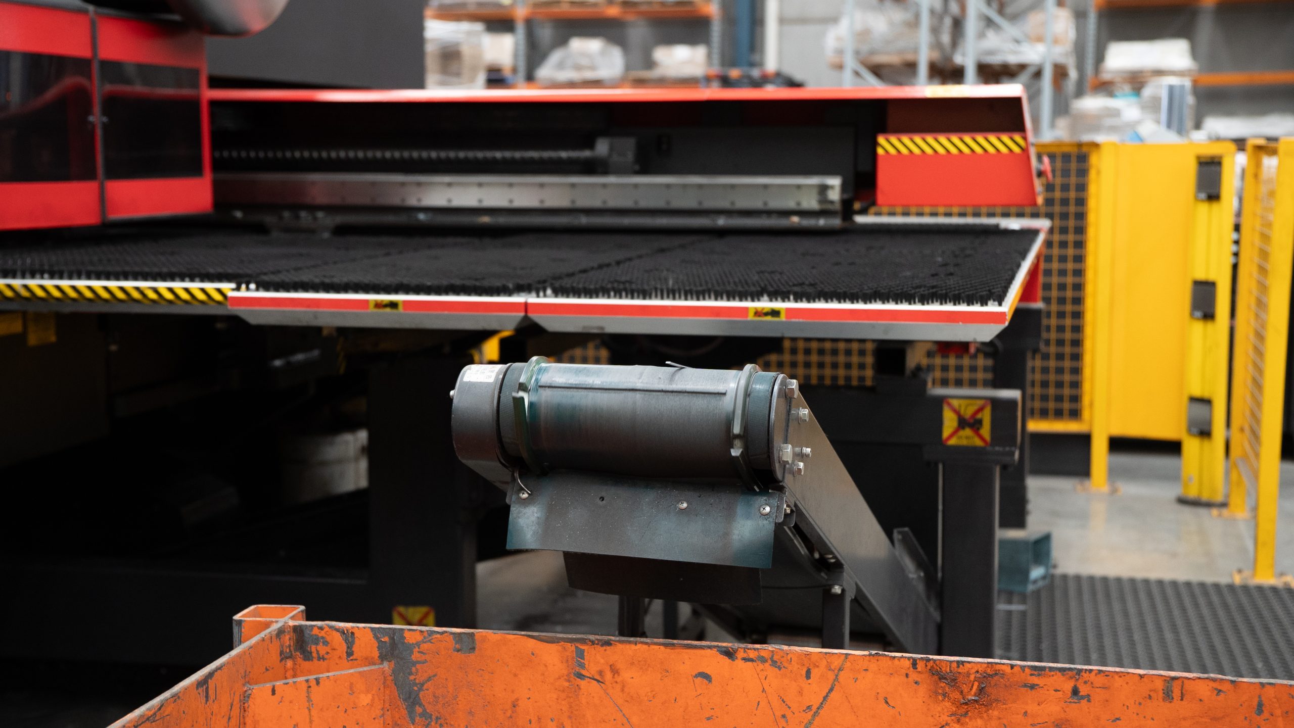 Operator loading sheet into the laser bed